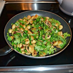 Add some color to your gnocchi with mushrooms and arugula