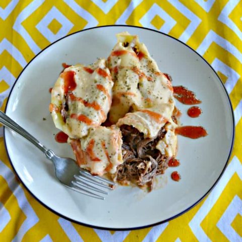 Grab a fork and a napkin then dig in to these mouthwatering BBQ Brisket Stuffed Mac N Cheese Shells
