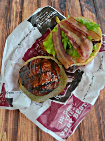 Jalapeno Cheddar Stuffed Burgers brushed with BBQ Sauce and topped with bacon and lettuce