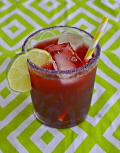 Made with fresh blackberries and lime, you'll love this Blackberry Margarita on the rocks!