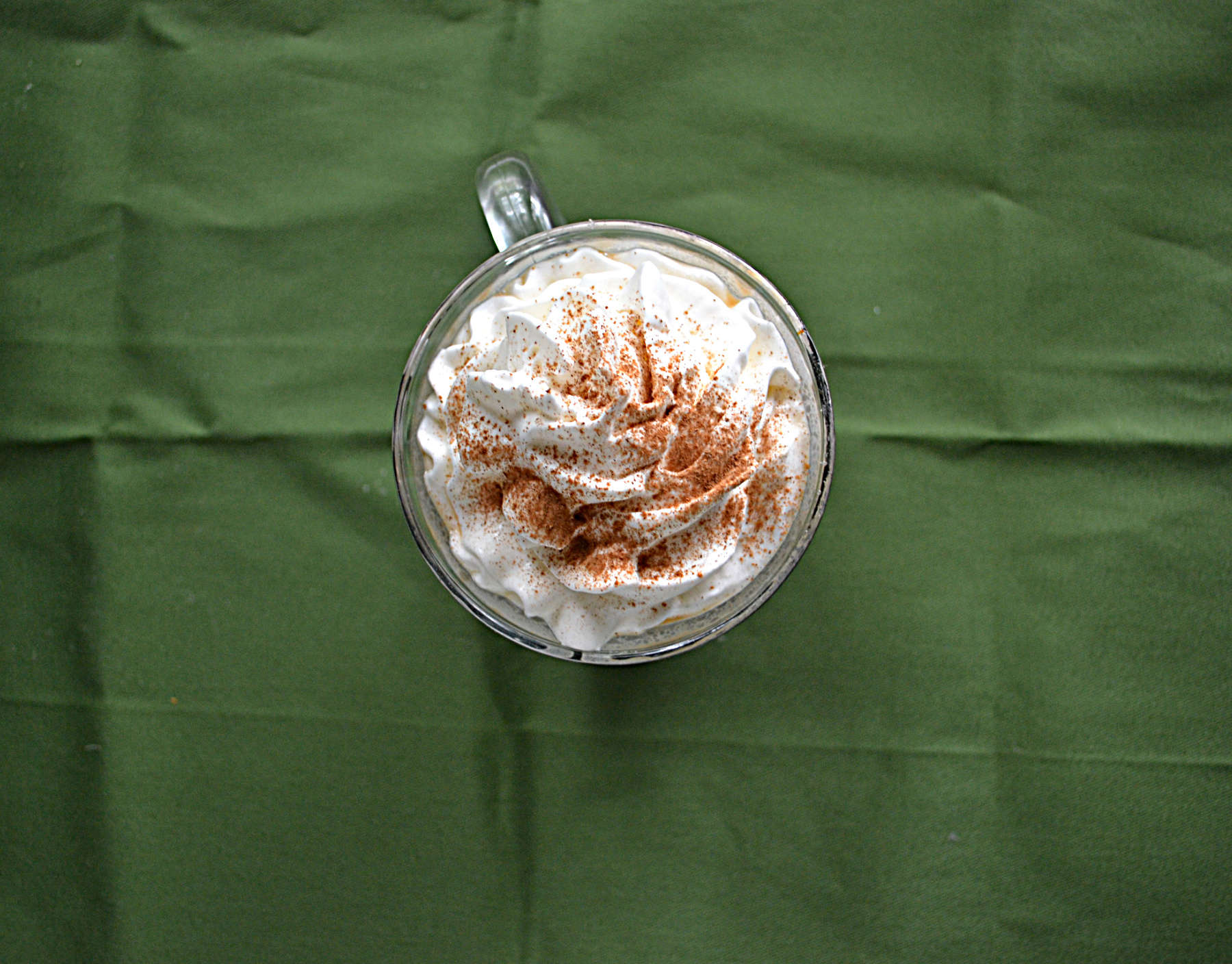 A top view of the whipped cream on a pumpkin Latte.