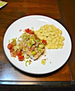 Looking for a flavorful baked fish recipe? Check out this Deviled Breadcrumb Fish with Leeks, Bacon, and Tomatoees