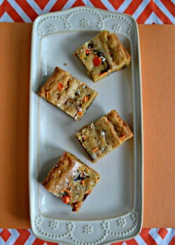 You can't go wrong with Halloween Blondies filled with chocolate M&M's and pumpkin chips topped with sprinkles!