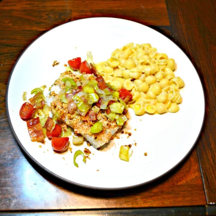 Deviled Breadcrumb Fish with Bacon, Leeks, and Tomatoes is a flavorful meal