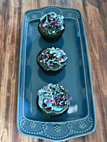 Blue Velvet Galaxy Cupcakes are topped with two toned frosting and Milky Way sprinkles