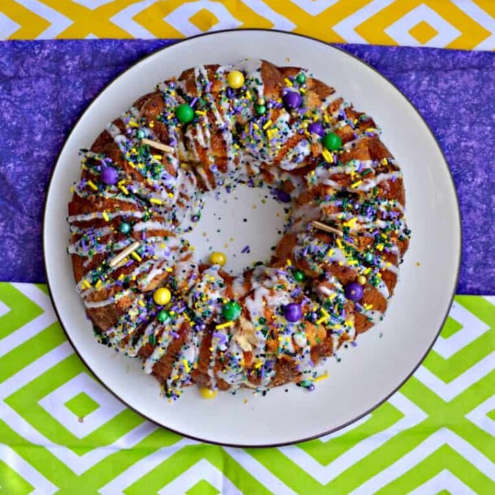 I love these fun sprinkles and cream cheese drizzle on this Mardi Gras Monkey Bread King Cake!