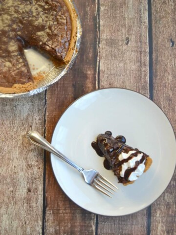 Celebrate Pie Day with this decadent Brownie Pie topped with ice cream or whipped cream.