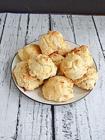 A plate piled high with fluffy biscuits.