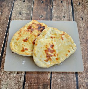 Naan is a flatbread baked in the oven and brushed with butter