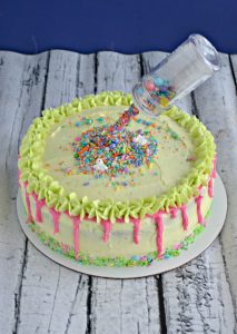 A lightly lemon flavored cake with pink drips and an anti-gravity feature