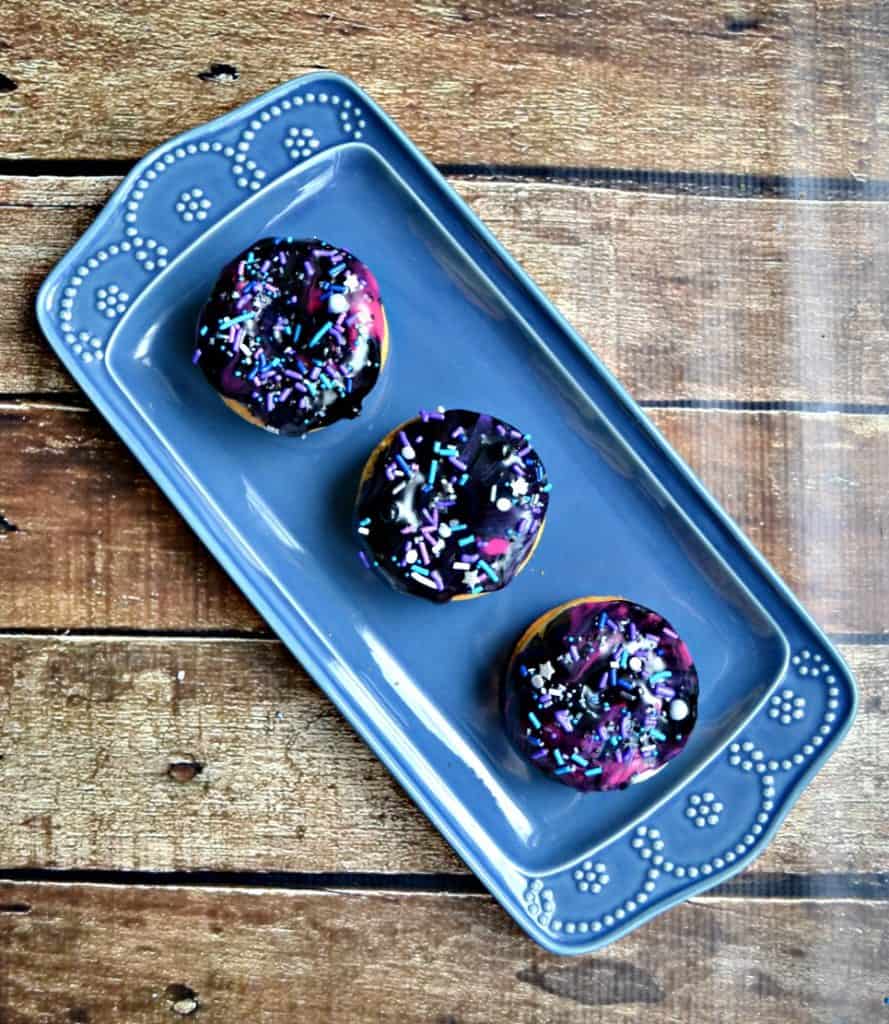 Looking for a fun breakfast the whole family can enjoy? These Baked Galaxy Donuts with sprinkles will be a hit!