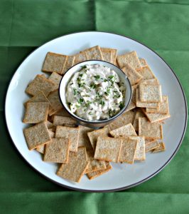Sour Cream and Onion Cheddar Dip is best served with crackers and chips.