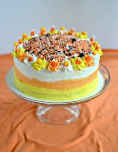 A Candy Corn Cake with sprinkles on top.
