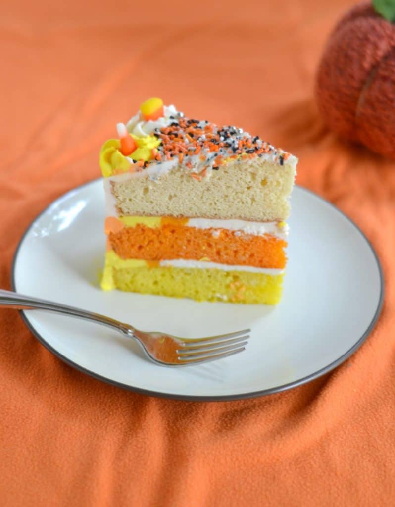 Grab a fork and dig into this Candy Corn Layer Cake with triple colored frosting and cake!