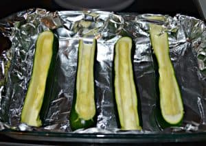 Scoop out the centers of zucchini to make Sausage Stuffed Zucchini Boats