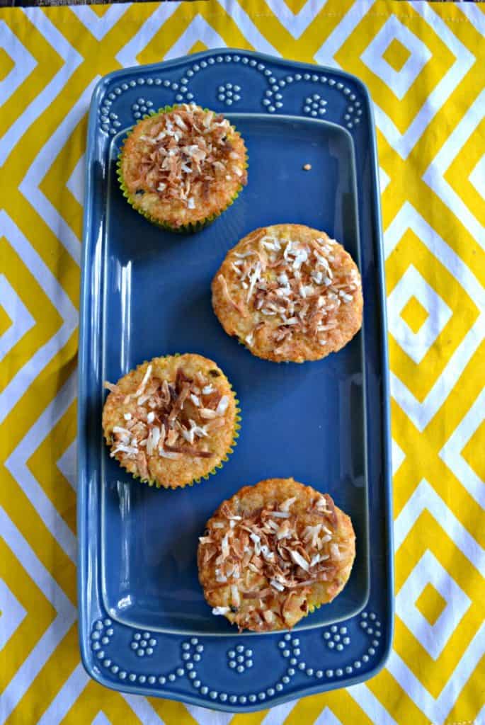 Get a taste of the tropics with these Banana, Papaya, and Passion Fruit Muffins topped with toasted coconut.