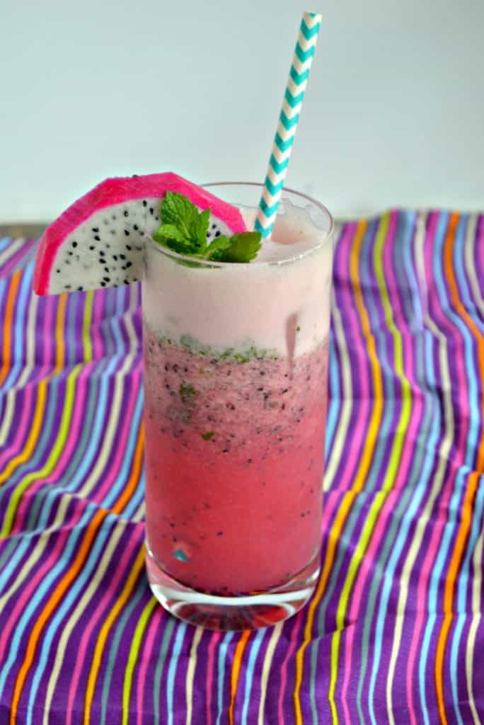 Looking for a twist on the classic mojito? This Dragon Fruit Pomegranate Mojito is super fun!