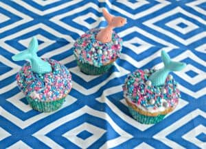 Lemon Mermaid Cupcakes with sparkling sprinkles and candy mermaid tails!