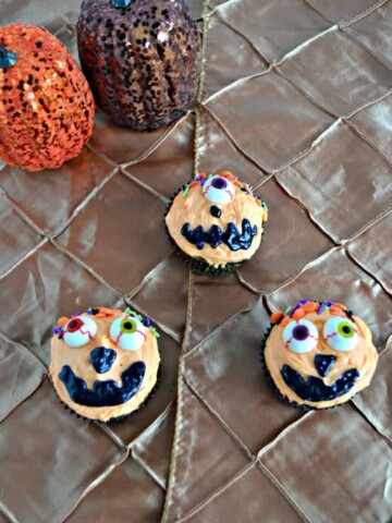 Grab some fun eyeballs and candies and make these Caramel Swirl Silly Pumpkin Cupcakes for Halloween!