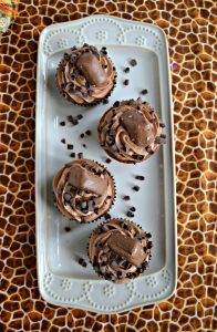 If you like chocolate you'll want to take a bite out of these amazing Triple Chocolate Cupcakes topped with chocolate caraamel truffles and chocolate curls!