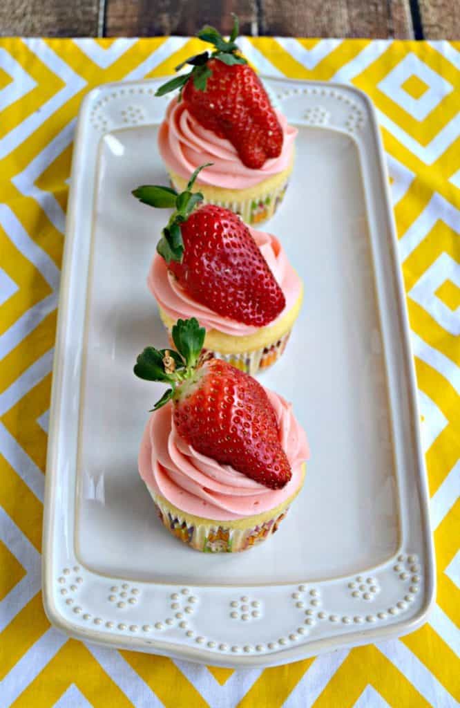 Lemon cupcakes with fresh strawberry frosting and strawberries