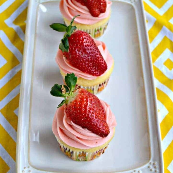 Lemon cupcakes with fresh strawberry frosting and strawberries