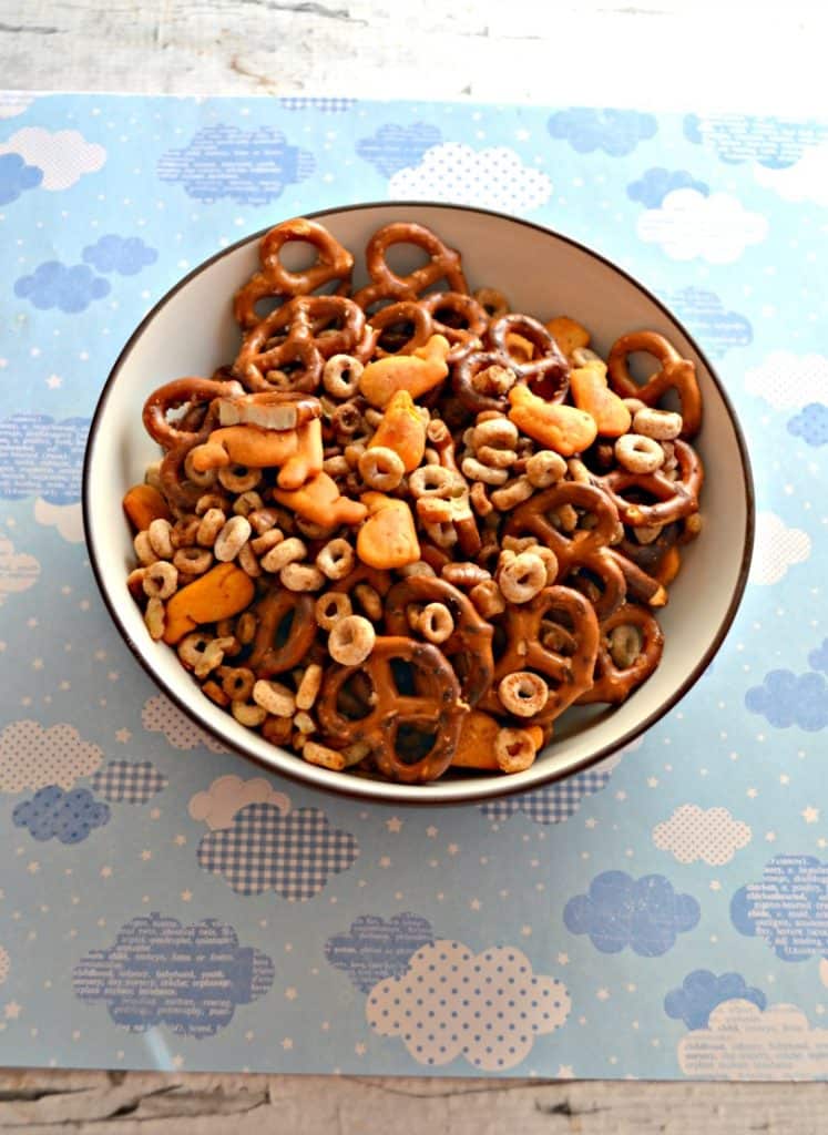 A bowl of party mix with Cheerios