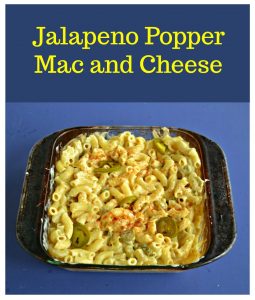 Pin Image: A dish of Jalapeno Popper Mac and Cheese on a bluebackground with text.