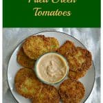Pin Image: text overlay, a plate topped with golden brown fried green tomatoes and a bowl of remoulade in the middle.