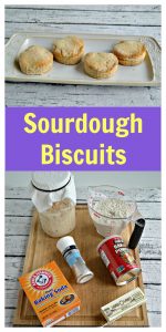 Pin Image: A plate lined with four biscuits on a white wooden backdrop, text overlay, a cutting board topped with a sourdough starteer, baking soda, salt, butter, and flour.
