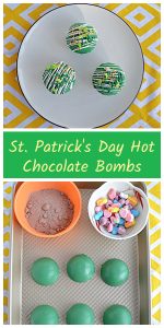 Pin Image: A plate with three green Hot Chocolate Bombs on it on a yellow background, text, a cutting board with a bowl of hot cocoa mix, a bowl of colorful marshmallows, and green chocolate spheres.