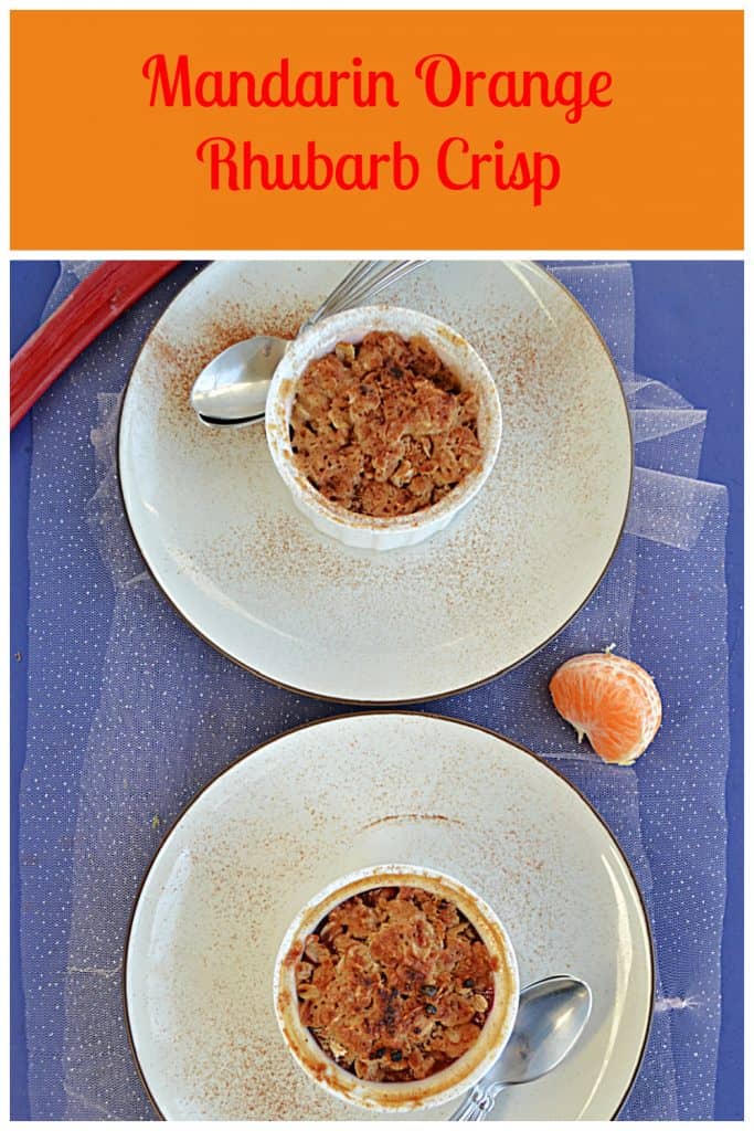 Pin Image: Text, A top view of two plates with two ramekins on them with golden brown crumble on top each with two spoons on the plate with a stalk of rhubarb at the top and half an orange beside the plates.