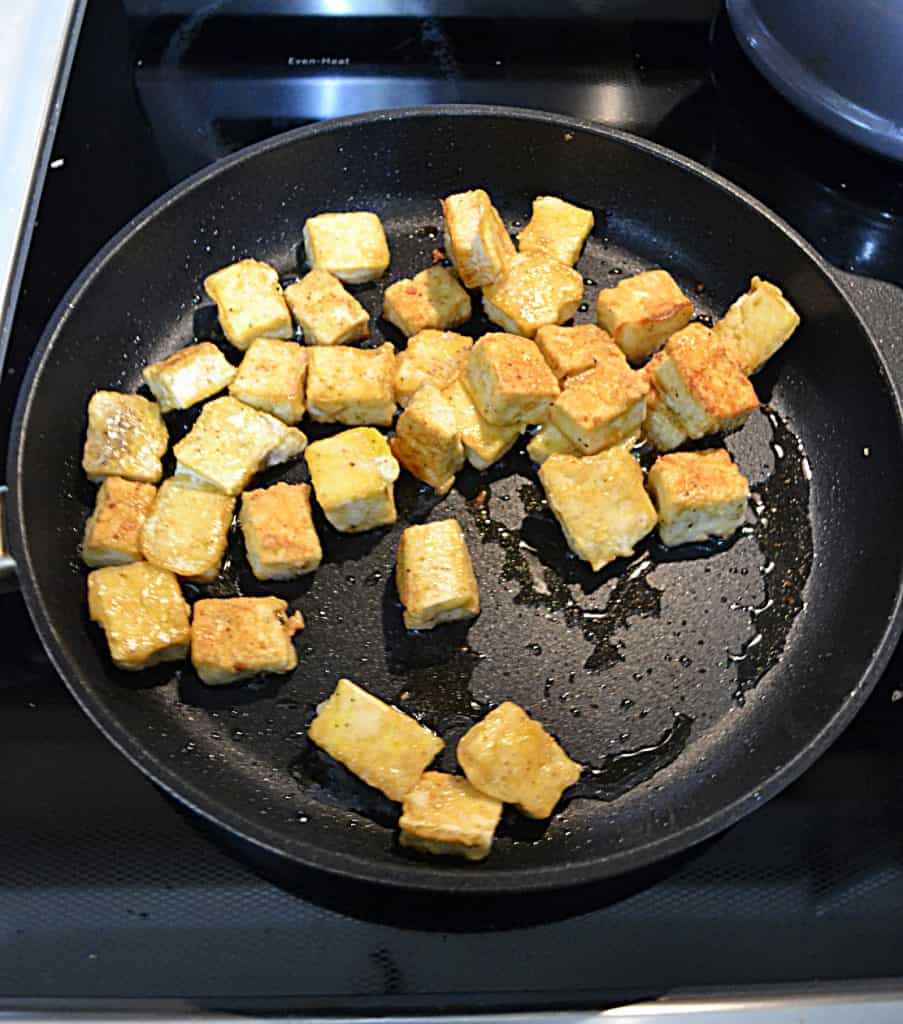 A saute pan full of crispy tofu.