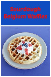 Pin image: Text, A plate with a Belgium waffle topped with whipped cream, blueberries, and strawberries.