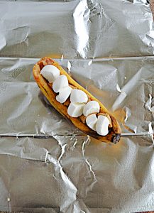 A banana stuffed with chocolate chips and graham cracker pieces and marshmallows.
