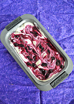 A pan of blueberry swirled ice cream.