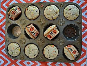 A cupcake pan with 10 cupcakes in the pan.