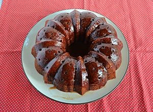 A plate with an Apple Cider Bundt Cake on it.