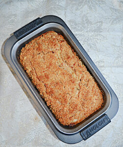 A loaf pan with Pear Bread in it.