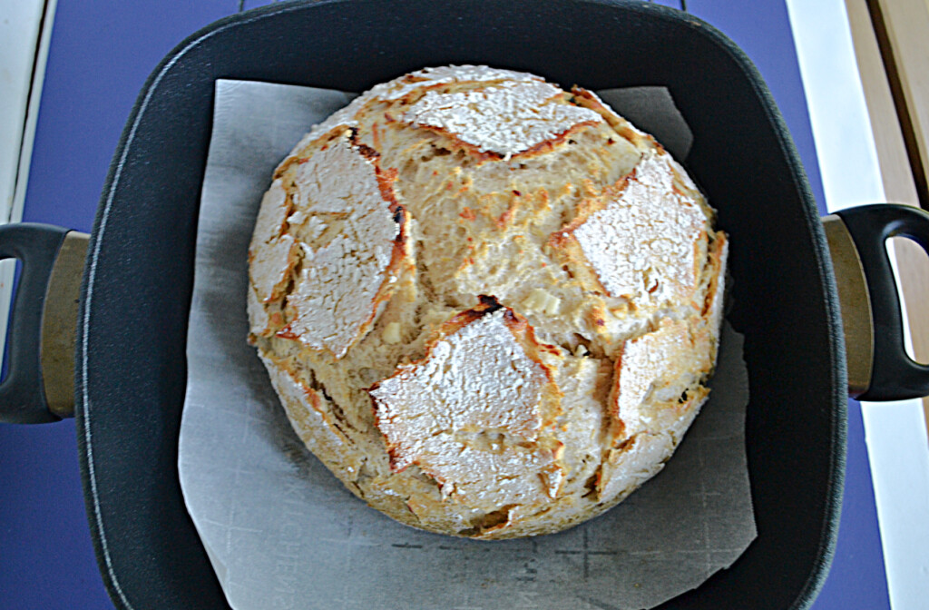 A golden brown loaf of Sourdough Bread.