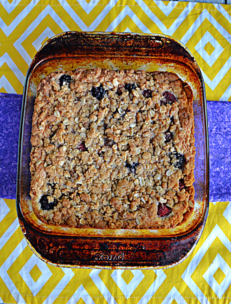A baking dish with berry crumb cake in it.