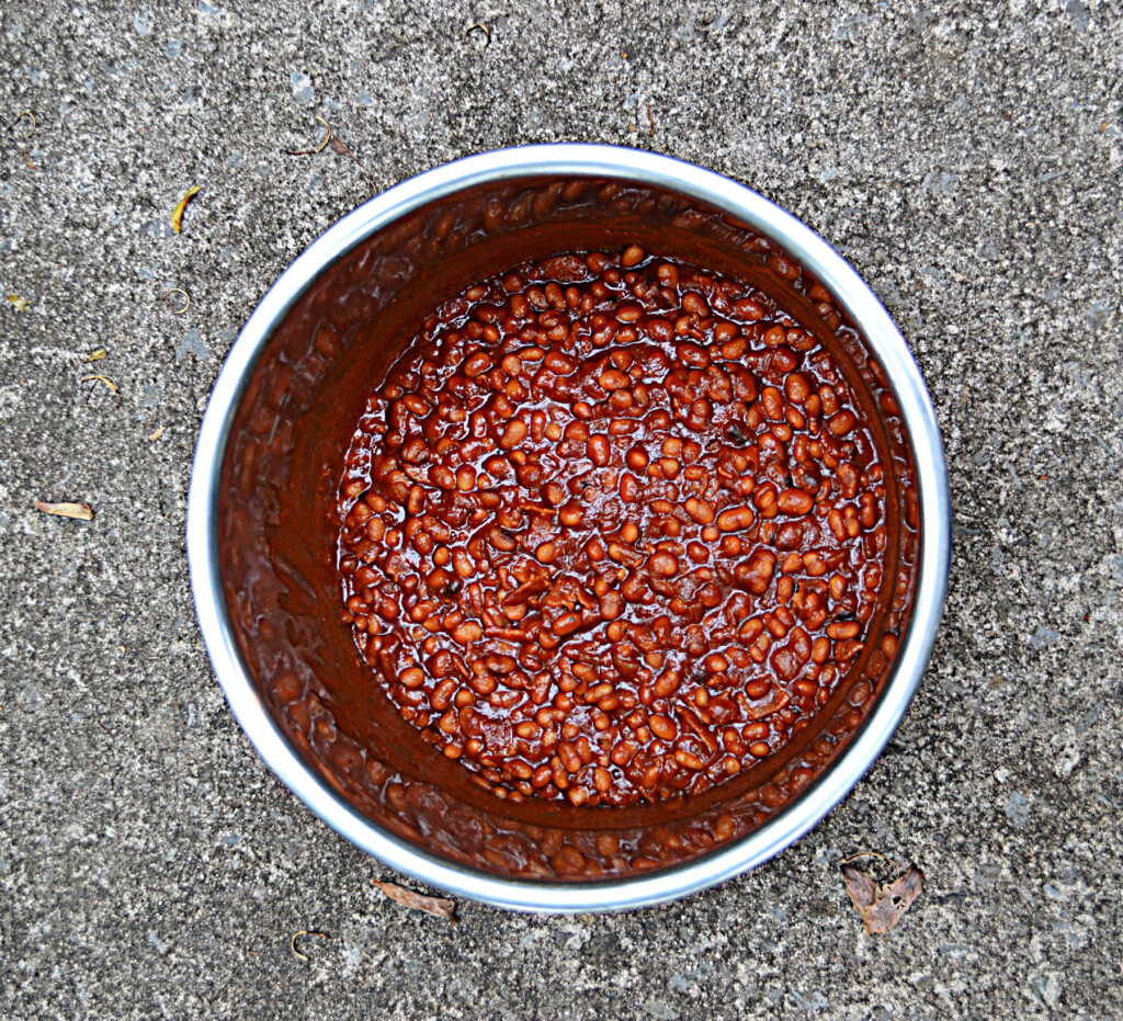 A pot full of baked beans. 
