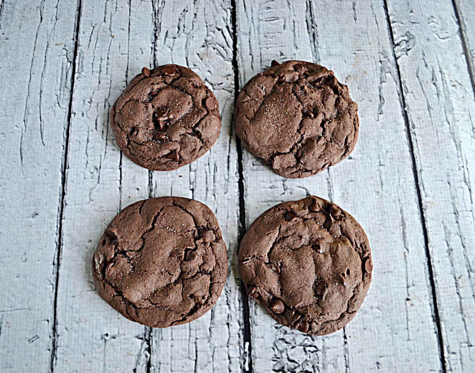 Four Brownie Baatter Cookies on a white background.