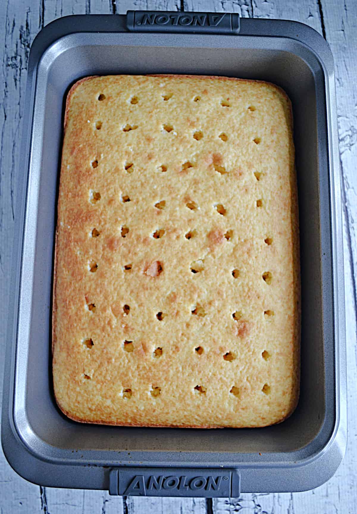 A cake in a pan with holes poked in it.