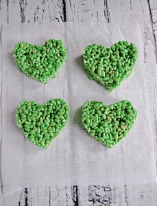 Four green heart shaped Rice Krispies Treats