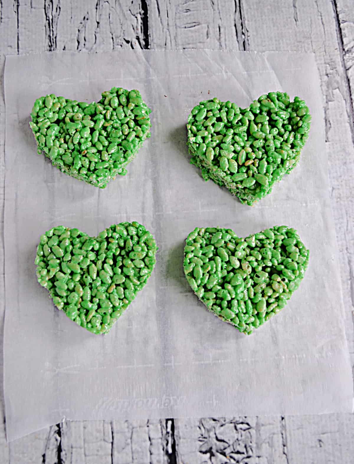 Four green heart shaped Rice Krispies Treats
