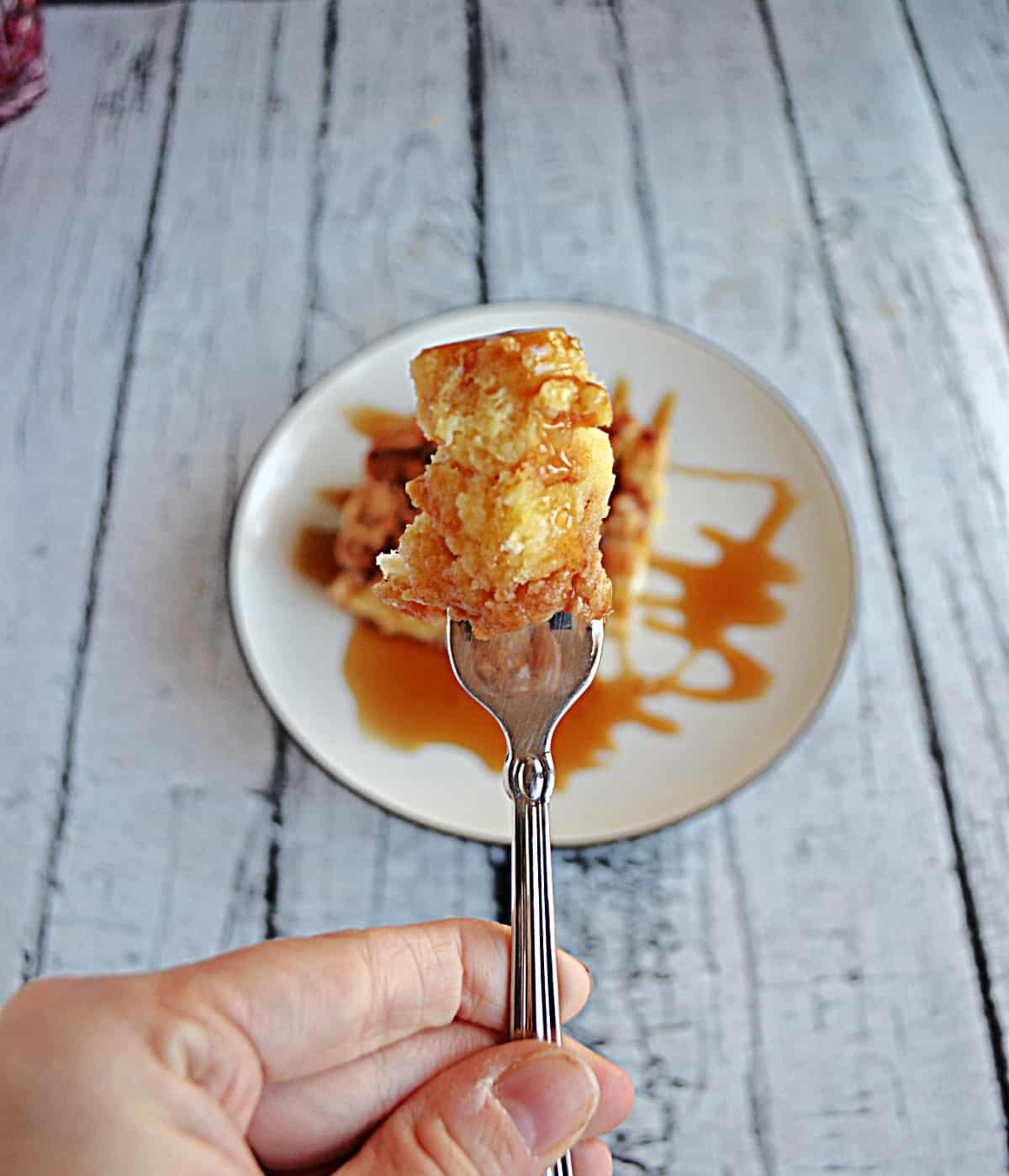 A fork holding a bit of French Toast