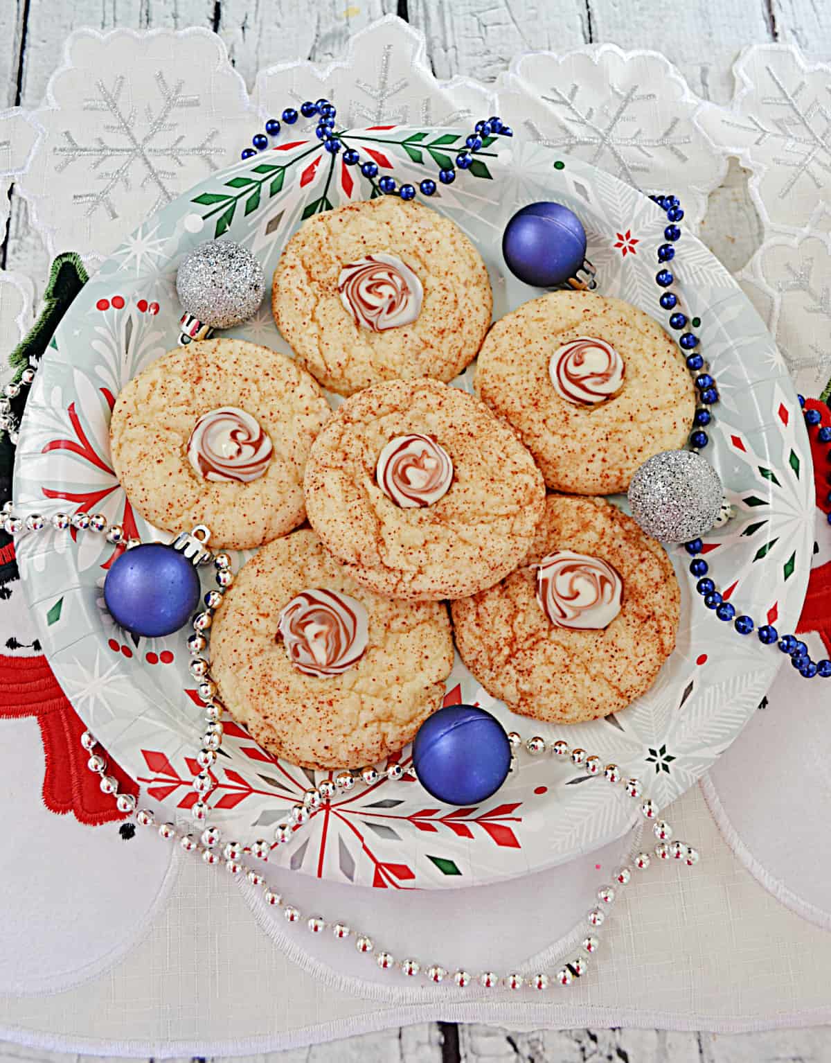A plate of Cappuccino Cookies with ornaments on the plate.