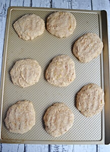 A cookie sheet with banana bread cookies on it.