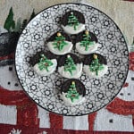 A plate of Holiday Oreos stacked into a tree shape.